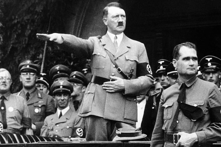 Adolf Hitler and his personal representative Rudolf Hess on Dec. 30, 1938. Minister of propaganda Joseph Goebbels is next to Hitler at left.