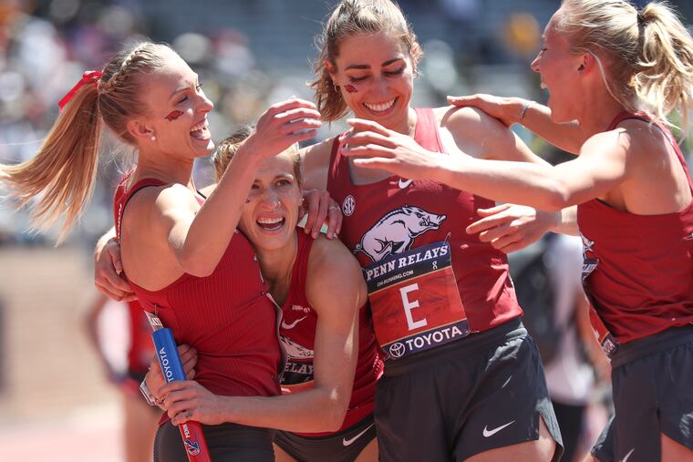 Arkansas celebrates their win in the College Women's 4x1500 Championship of America.