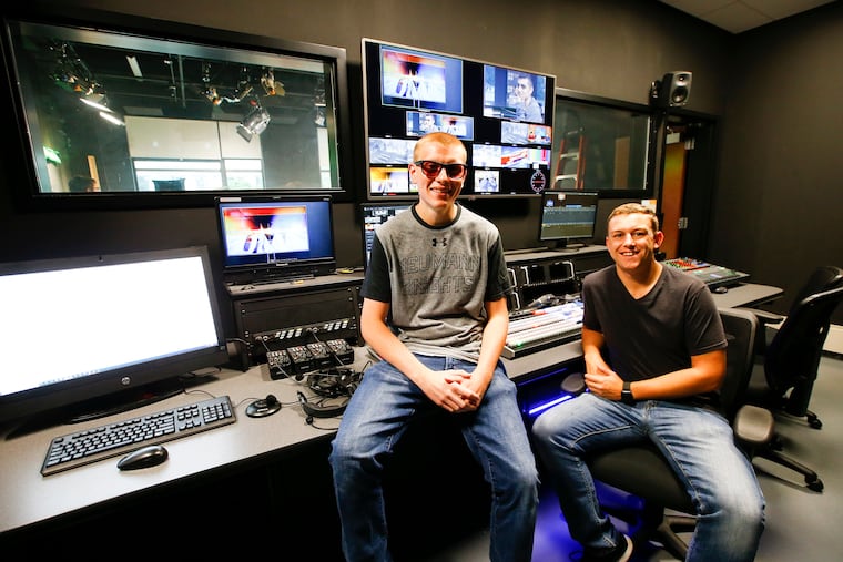 Neumann University Communications and digital media major Jake Loburak (left) with partner Sean Spence in the Neumann Media control room at the Mullen Communication Building in the Bruder Life Center at Neumann University in Aston, Pa.