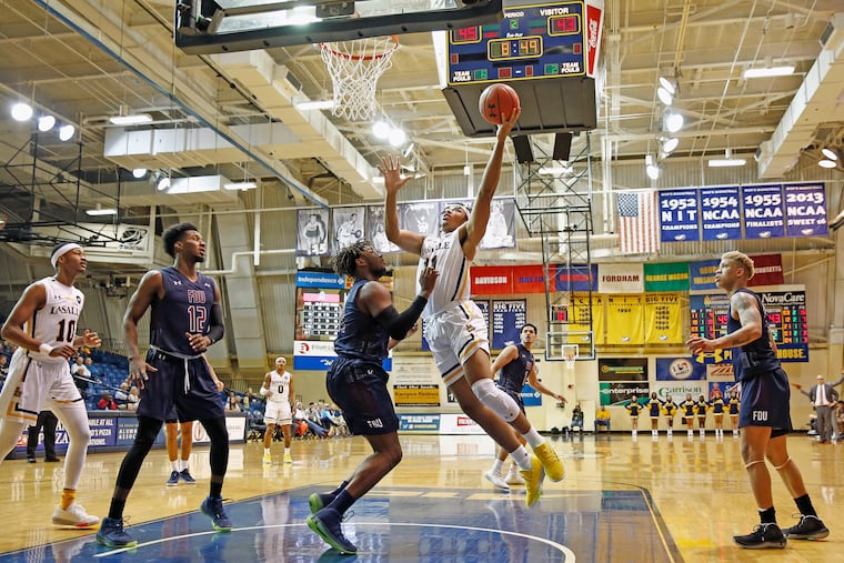 La Salle forward Ed Croswell shoots over Fairleigh Dickinson forward Elyjah Williams during the second half.