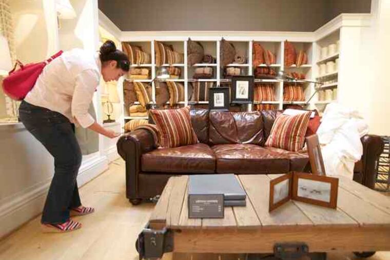 Joanne Garibay checks the price of a sofa in Pasadena, Calif. Consumer confidence hit its highest level since Sept. 2008.