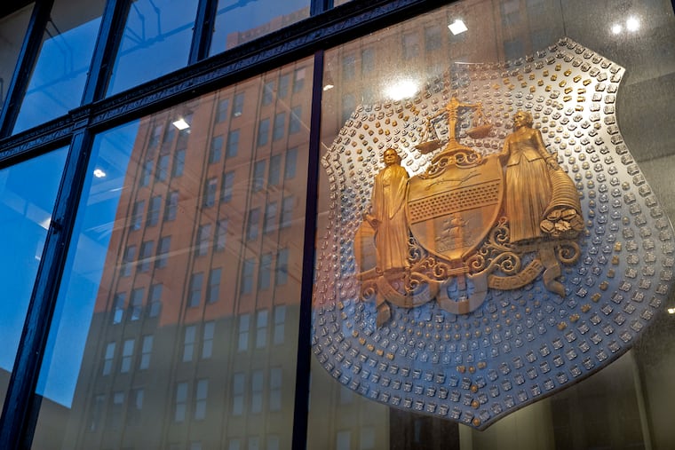 A sculpture is seen at the headquarters of the Philadelphia Police Department. An arbitrator ruled that the city may replace some sworn police officers with civilians.