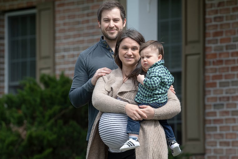 Roman and Caitlin Albright with their 15-month-old son, Roman, at their home in Chester Springs.