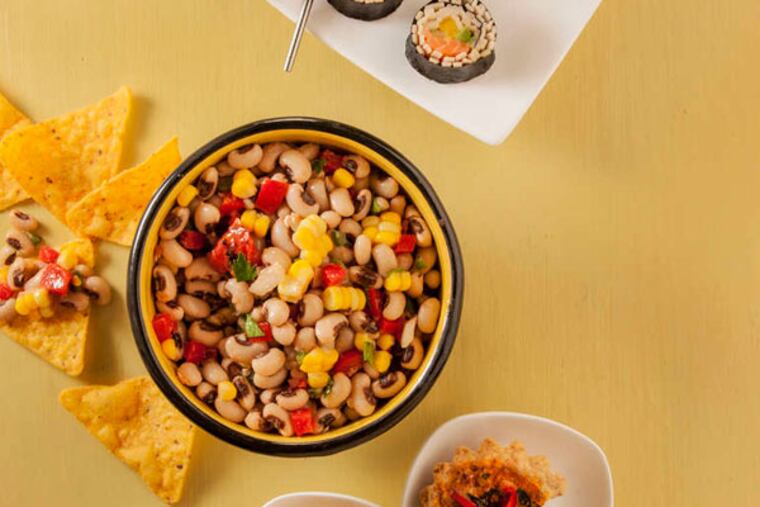 Foods that symbolize good luck, like long noodles, make excellent New Year’s Eve dishes. (PHOTO: McClatchy News)