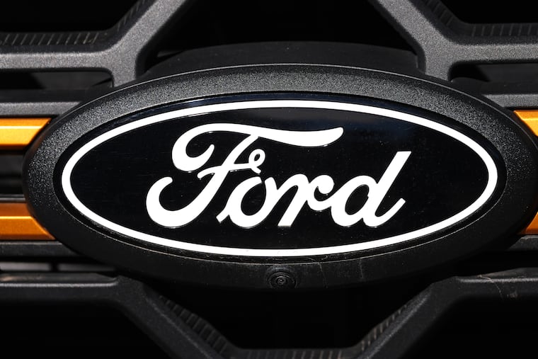 The company logo is shown on the grille of a new 2026 F-series pickup truck on the lot of a Ford dealership in Littleton, Colo.