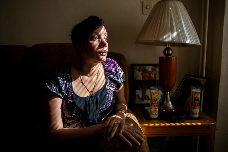 Linda McNeill, 57, seen at home in Germantown, lost her youngest son Julius Luke, 31, to gun violence May 9, 2018. Her oldest son, Kareem Luke, 38, is charged with murder in his brother's death, while the alleged shooter and an alleged accomplice were given immunity to testify against him.