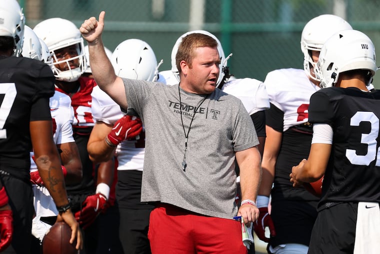 Temple special teams analyst John Fisher talks to the team Monday as the second week of training camp began.