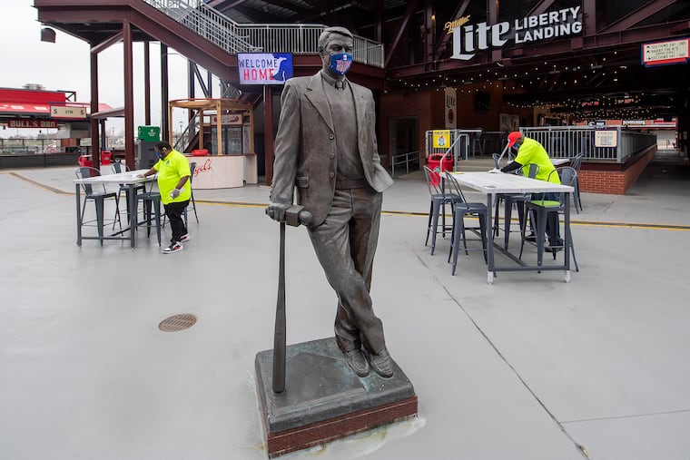 A statue of Harry Kalas wears a face mask during a tour on the COVID-19 protocols and enhanced safety guidelines that fans should be aware of when they return to Philadelphia Phillies baseball games at Citizens Bank Park.