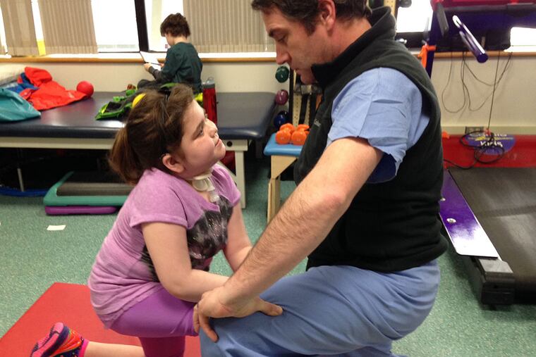 HE1lung02. Cutline info: Sarah Murnaghan with exercise physiologist Mike McBride, who does physical rehabilitation with her three times a week at Children's Hospital of Philadelphia. (April 1, 2014)
Credit: Courtesy of Janet Murnaghan