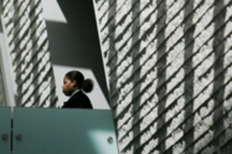 In the Perelman's Skylit Galleria, shadows from metal girders fall across the facade of new galleries, which will exhibit the museum's holdings of prints and photography, costume and textiles, and modern and contemporary design.