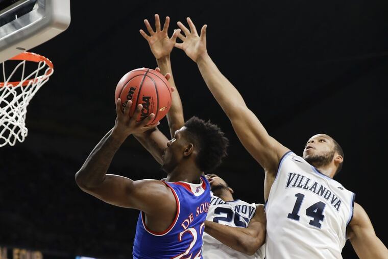 Villanova forward/guard Mikal Bridges and forward Omari Spellman double team Kansas forward Silvio De Sousa during the first-half in the NCAA Basketball Championship semifinals game on Saturday, March 31, 2018 at the Alamodome in San Antonio.