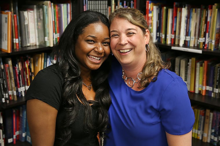 When Courtney Scott (left) received her diploma from Haverford College, her fifth-grade teacher at KIPP, Susan Larson, was there to cheer her on. DAVID MAIALETTI / Staff Photographer