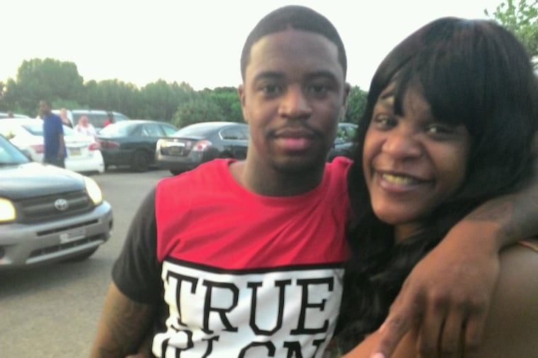 Dennis Plowden Jr. (left), with his mother, Chinita McCoy, in a 2016 family photo. Plowden was shot by police Dec. 27, 2017, at Nedro Avenue and Opal Street in East Germantown, and died the next morning.