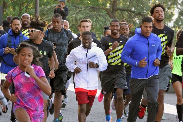 Comedian Kevin Hart sets the pace Saturday in a five-kilometer race. Hart, who has a sold-out show Sunday at Lincoln Financial Field, greeted finishers at the Art Museum steps after completing his run.