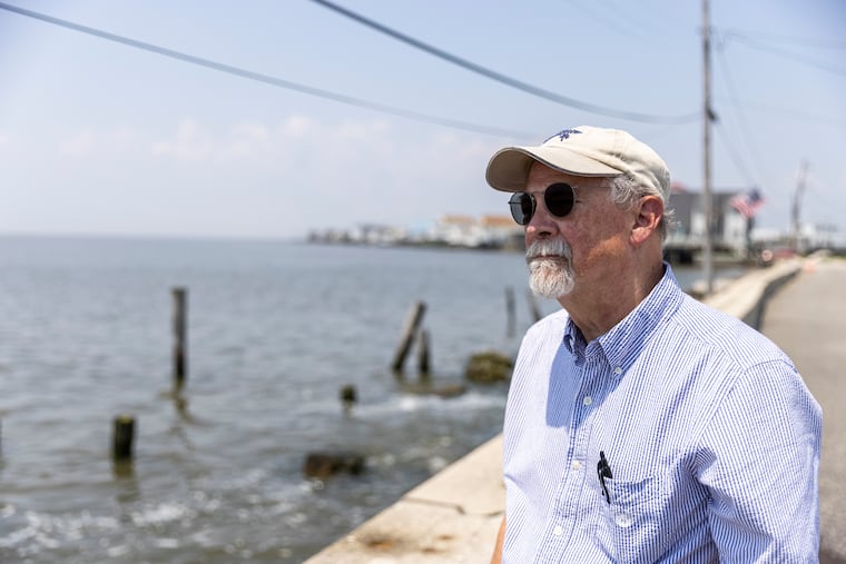 Hal Taylor, writer and illustrator, along the bulkhead that separates in Gandy's Beach in Downe Township, Cumberland County, N.J., from Delaware Bay. His new book, 'The Book of Wedges - Tales from a Beach,' focuses mostly on vignettes about places and people along the Garden State's Delaware Bayshore.