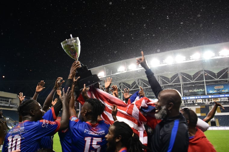Team Liberia celebrates its 2021 Unity Cup title over Sierra Leone.