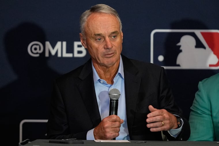 Commissioner Rob Manfred answers questions during a news conference at the winter meetings in December.