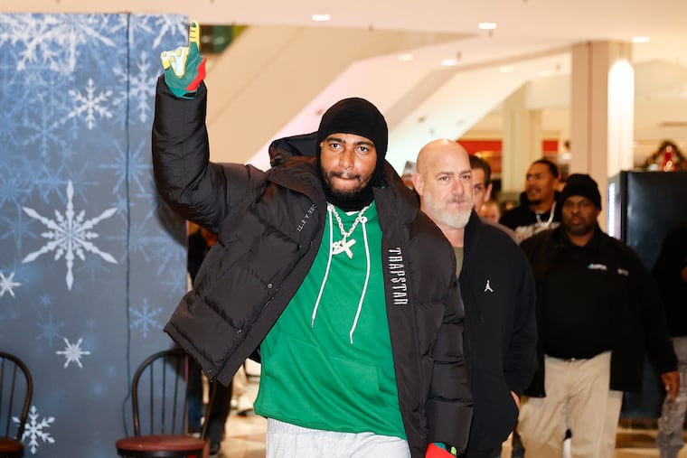 Former Eagles receiver DeSean Jackson acknowledges fans before signing autographs at the Dynasty Sports & Framing event inside the Oxford Valley Mall in Langhorne on Friday.