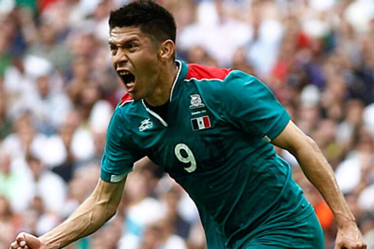 Mexico's Oribe Peralta celebrates after scoring against Brazil in the men's soccer final. (AP Photo/Jon Super)