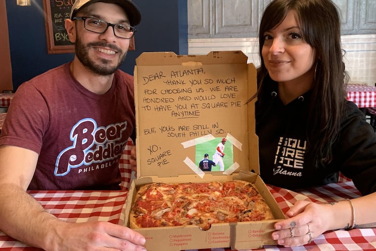 Square Pie owner Giuliano Lozzi, at left, with his cousin, Gianni Lozzi, at right, who came up with the idea for including a Philly message in the Atlanta Braves pizza order.
