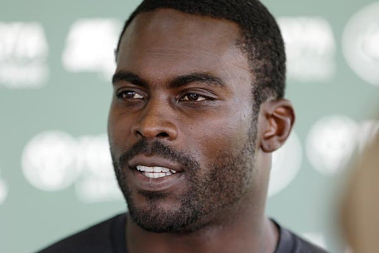 Jets quarterback Michael Vick responds to questions after during a news interview after practice during NFL football training camp Saturday, July 26, 2014, in Cortland, N.Y. (AP Photo)