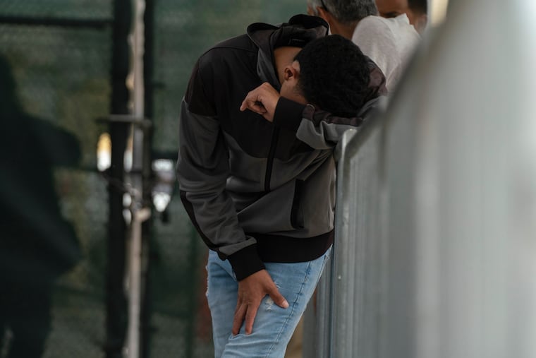 A migrant waits at the Gateway International Port of Entry under U.S. Customs and Border Protection custody in Brownsville, Texas, on May 5, 2023, before being sent back to Mexico under Title 42.