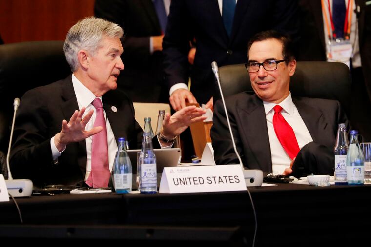 Federal Reserve Chairman Jerome Powell talks with U.S. Treasury Secretary Steven Mnuchin during the G20 Finance Ministers and Central Bank Governors Meeting, Saturday, June 8, 2019, in Fukuoka, Japan.