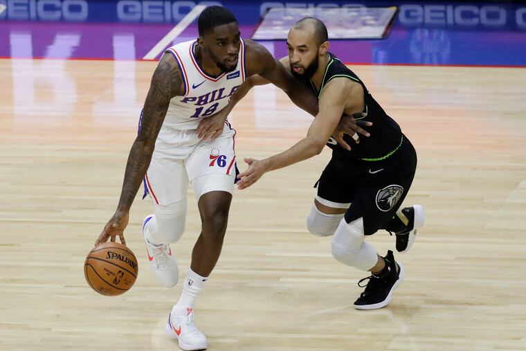 Sixers guard Shake Milton seeks a way past Timberwolves guard Jordan McLaughlin on April 3.