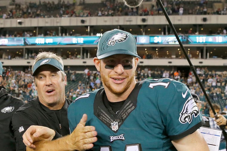 Former Eagles' quarterback Carson Wentz and former Head Coach Doug Pederson in happier times