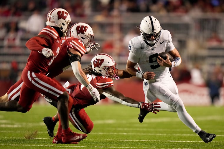 Penn State's Beau Pribula, right, tries to get away from Wisconsin's Darryl Peterson (17), Ricardo Hallman (2) and Hunter Wohler (24) during the second half of their game in Madison on Saturday.