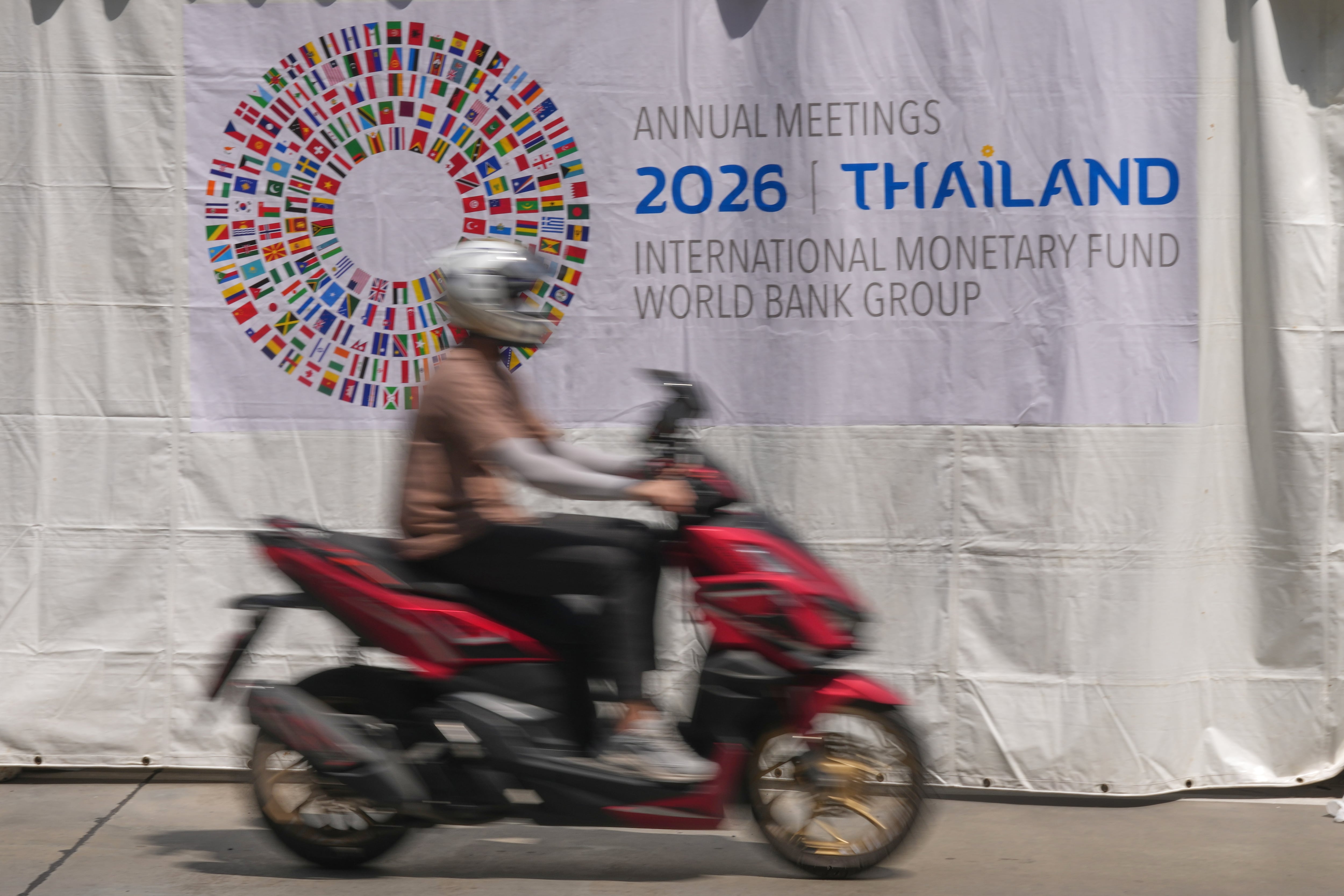 IMF raises its forecast for world growth this year but warns of risks from AI boom and debt