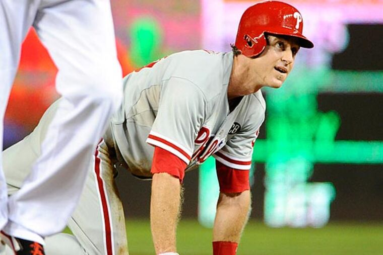 Philadelphia Phillies second baseman Chase Utley (26) reacts after being picked off first base by Washington Nationals during the fourth inning at Nationals Park. (Brad Mills/USA Today)