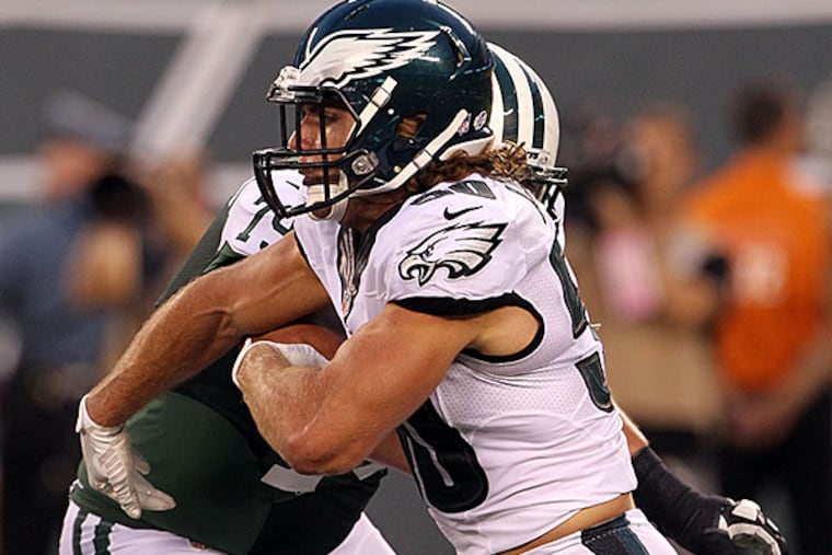 Eagles' Kiko Alonso runs past New York Jets' Brent Qvale during the first-quarter in a preseson game on Thursday, September 3, 2015 in East Rutherford, NJ.