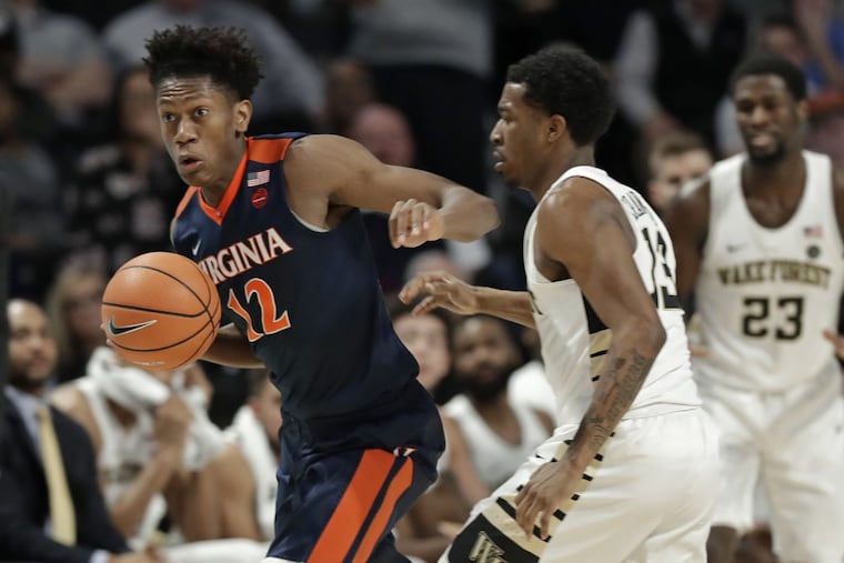 Virginia's De'Andre Hunter (12) stealing the ball from Wake Forest's Bryant Crawford (13) during the second half Jan. 21.