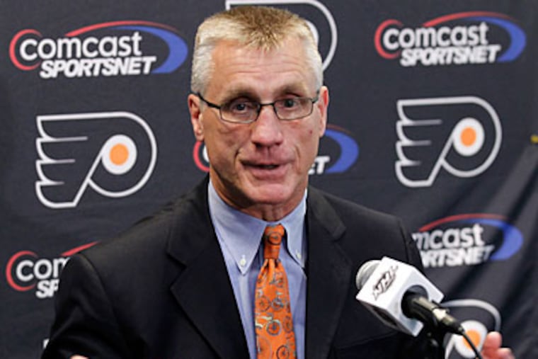 Flyers general manager Paul Holmgren could be playing a gutsy game of poker in the NHL free agent market. (Alex Brandon/AP)