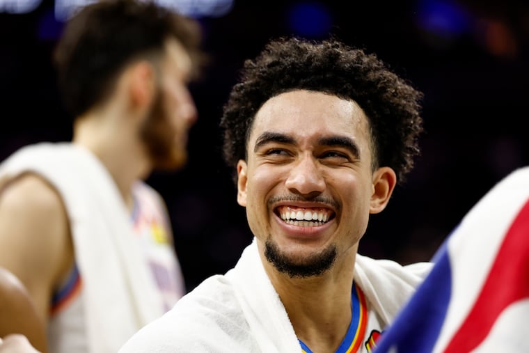 Thunder guard Jared McCain laughs with teammates after the game at Xfinity Mobile Arena. He scored 13 points in 25 minutes in his return to Philly.