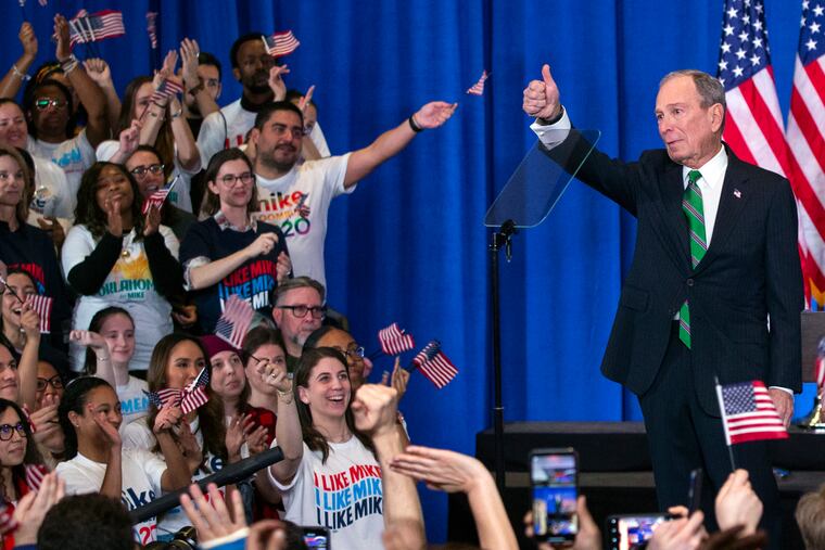 Former Democratic presidential candidate Mike Bloomberg gestures to supporters as he announces the suspension of his campaign and his endorsement of former Vice President Joe Biden for president in New York Wednesday , March 4, 2020.