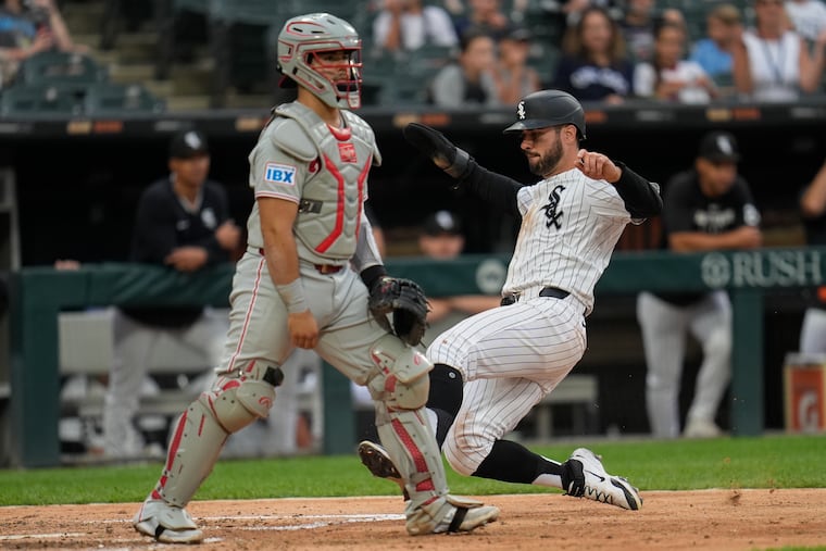 White Sox's Mike Tauchman (right) scored in the seventh inning as part of a seven-run inning to break the game open.