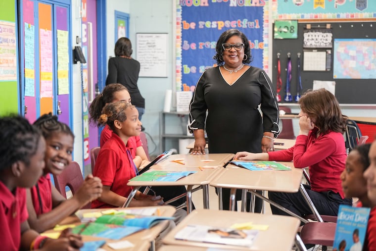 Principal Tameron Dancy with students at Robert Morris Elementary School in North Philadelphia.