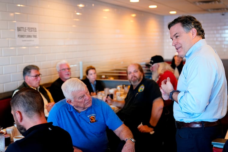 Dave McCormick, a Republican candidate for U.S. Senate in Pennsylvania, meets with attendees during a campaign event at the Round the Clock Diner in York, Pa., in April 2022.