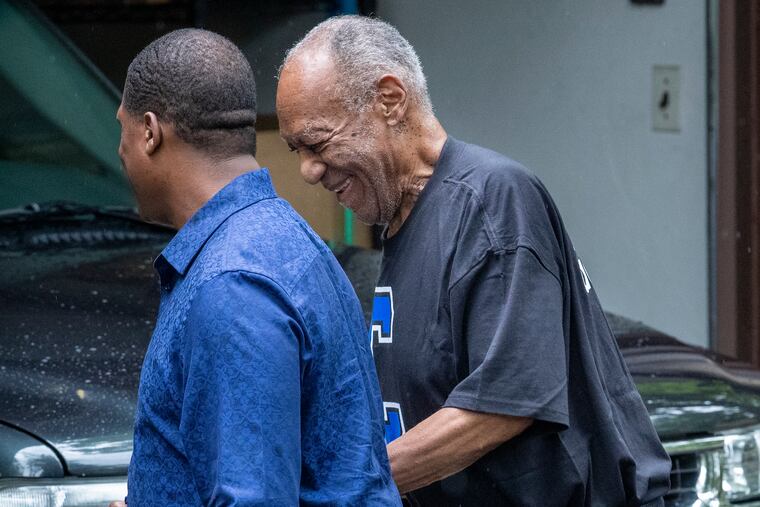 Bill Cosby, shown leaving his home in Elkins Park on June 1, 2021 with spokesman Andrew Wyatt (left).
