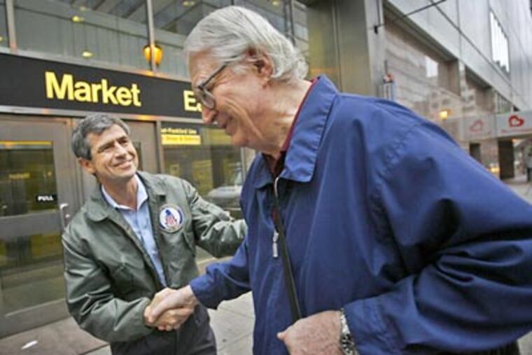 Rep. Joe Sestak greets Jim Shaw of New Jersey outside the Market East SEPTA station on Wednesday morning. Shaw waited for the opportunity to greet Sestak, who beat Sen. Arlen Specter in Tuesday's Democratic primary. (Alejandro A. Alvarez / Staff Photographer)