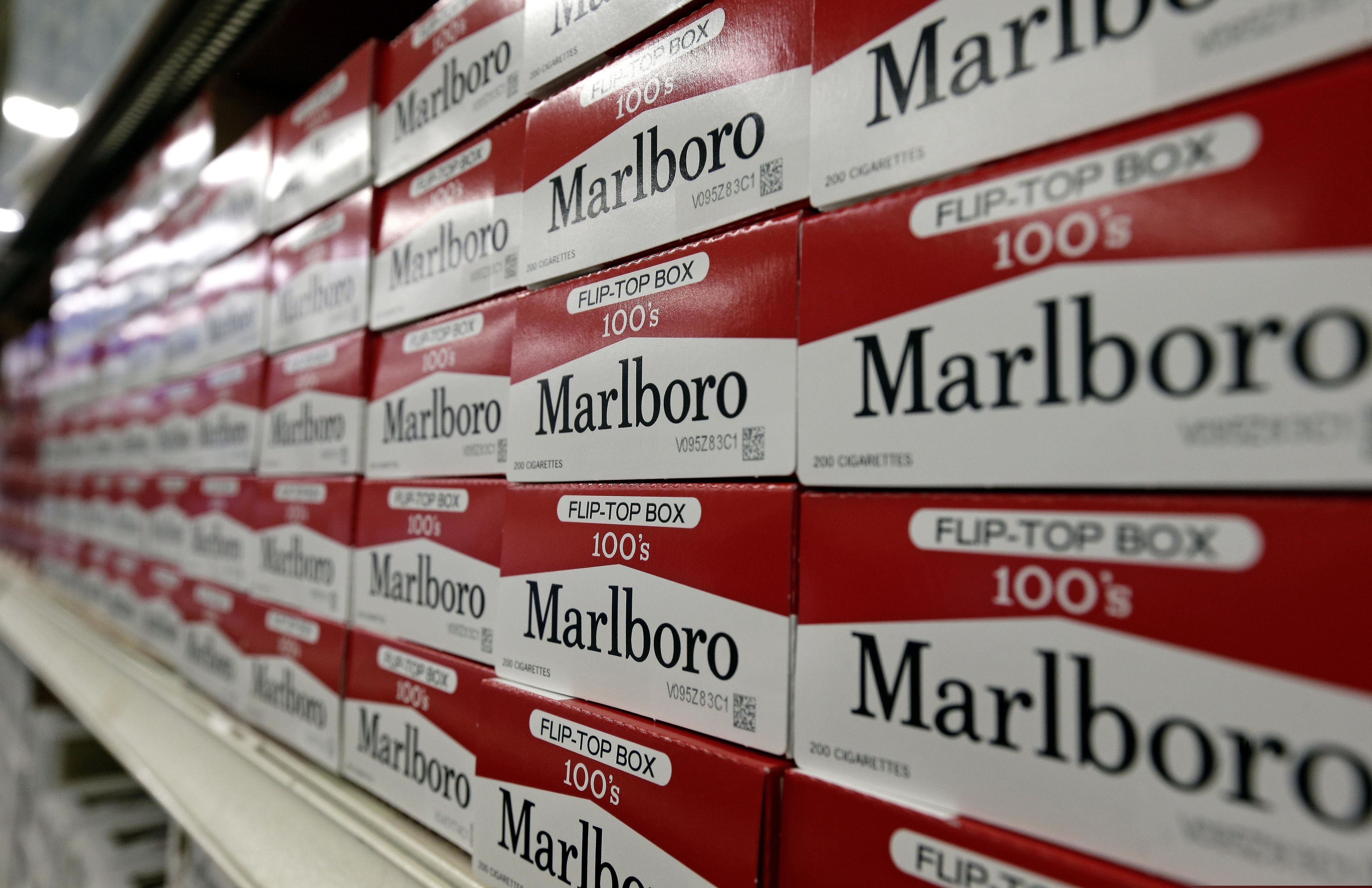 Cartons of Marlboro cigarettes on the shelves at JR Cigar Outlet in Burlington, N.C. Sen. Dick Durbin (D., Ill.) and other congressional Democrats introduced legislation to establish the first federal e-cigarette tax and increase the tobacco tax rate.