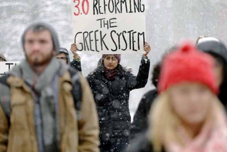 Protesters gathering at Penn State on Friday to denounce allegations that students at a fraternity there had posted nude photos of sleeping or unconscious women on private Facebook pages. (MATT ROURKE / AP)