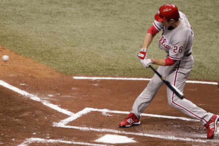 Chase Utley connects for a 2-run homer in the first inning of World Series Game One at Tropicana Field. ( David Maialetti / Staff Photographer )