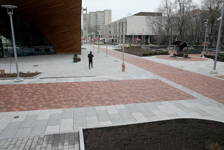 A man walks across the nearly empty Temple University campus in North Philadelphia last week.