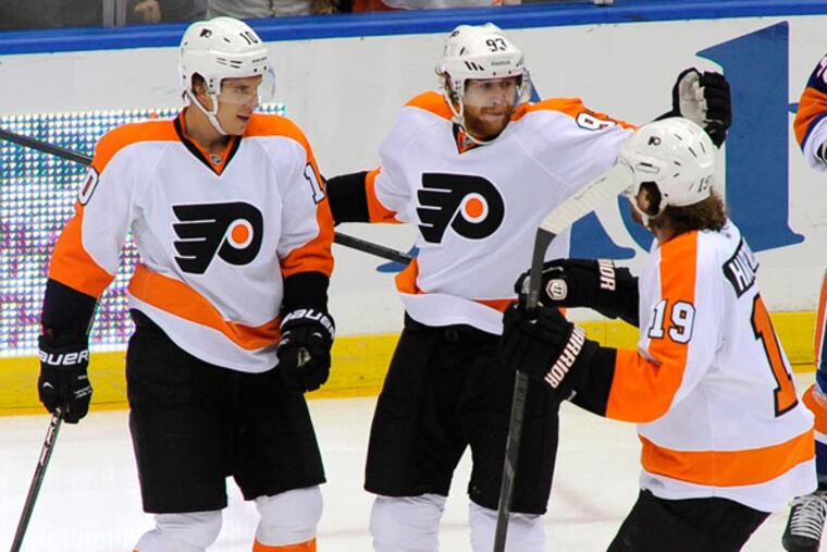 Flyers forwards Brayden Schenn (left), Jakub Voracek (center) and Scott Hartnell (right). (Kathy Kmonicek/AP)