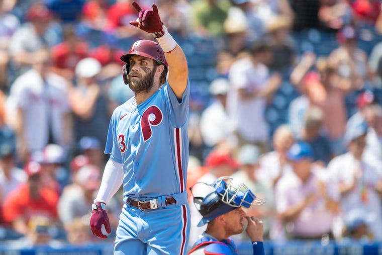 Bryce Harper celebrates after hitting a solo home run in the first inning against the Dodgers.
