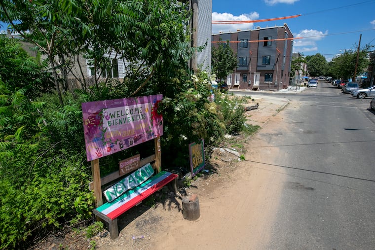 A sign for the Cesar Andreu Iglesias Community Garden on Lawrence Street looking north towards Norris Street on Monday, June 29, 2020.