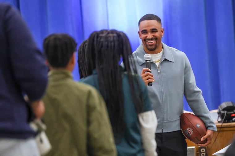Eagles quarterback Jalen Hurts takes questions from students in the auditorium of Edward Gideon Elementary School in Philadelphia on Friday, April 19, 2024. Hurts donated $200,000 to the Philadelphia School District to install new air conditioners in 10 schools. .